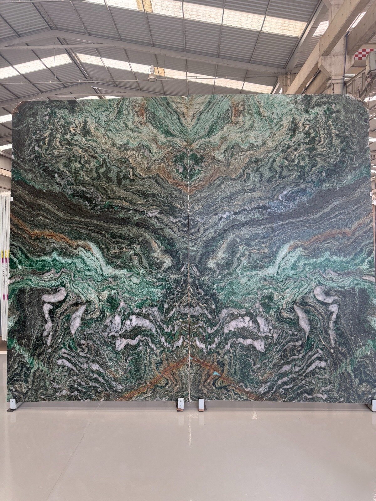 Book-matched pair of Pandora Green quartzite slabs with jewel-green swirls, gold veining and white quartz